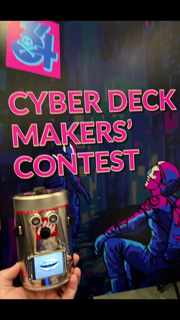 Jordan held up in front of a Cyber Deck Makers' Contest sign